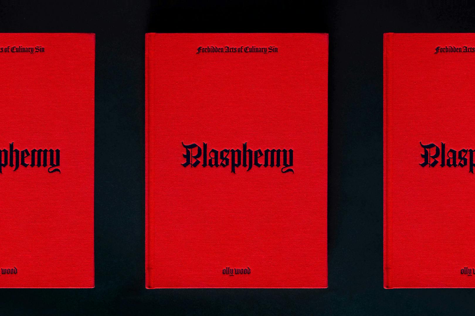 Row of three cookbooks with a read cover headlined 'blasphemy' in Gothic font