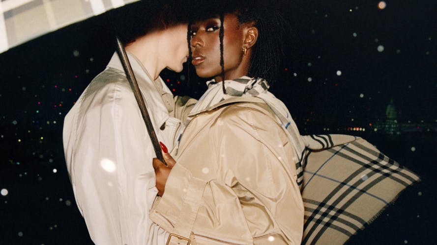 Still from Burberry's London in Love campaign showing actor Jodie Turner Smith holding an umbrella and wearing a trench coat