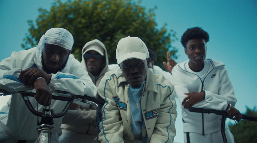 Still from CALM's mental health campaign This is Not a Drill featuring four young men wearing tracksuits looking into the camera