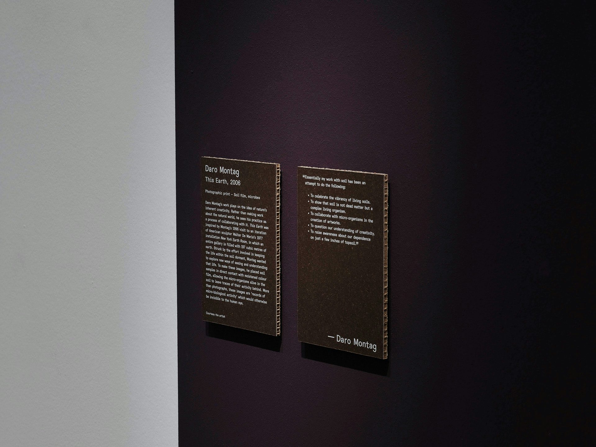A display at Somerset House's Soil exhibition featuring cardboard wall texts designed by Hato