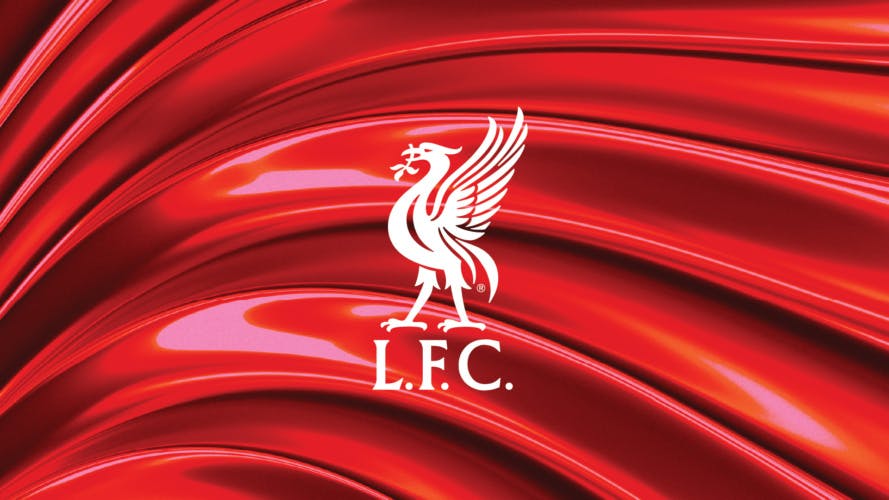 Liverpool emblem featuring a white Liver bird and the initials L.F.C laid over a red smoothly textured background