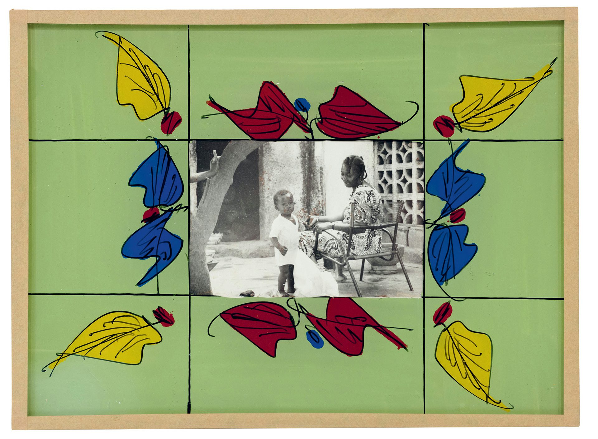 Black and white portrait of a person sat in a chair in a yard next to a young child, which is bordered by a green painted frame with red, blue and yellow leaves each displayed in a grid design