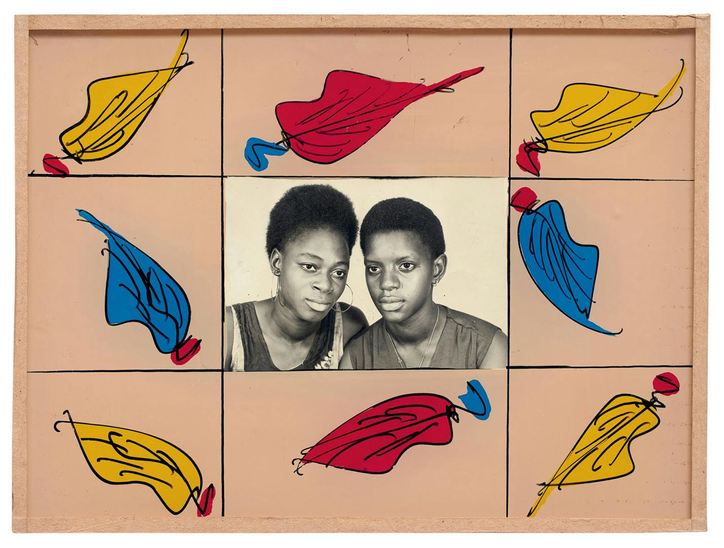 Black and white portrait of two people posing a studio, which is bordered by a taupe painted frame with red, blue and yellow leaves each displayed in a grid design