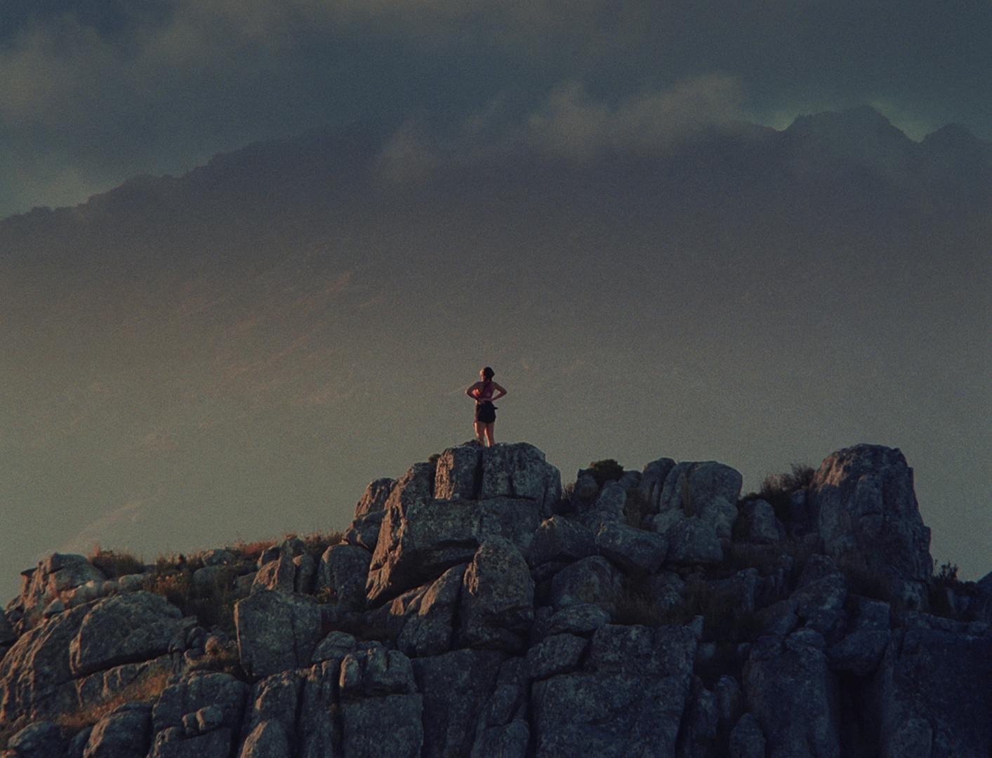 Still from Puma's Go Wild ad campaign showing a runner standing at the top of a hill