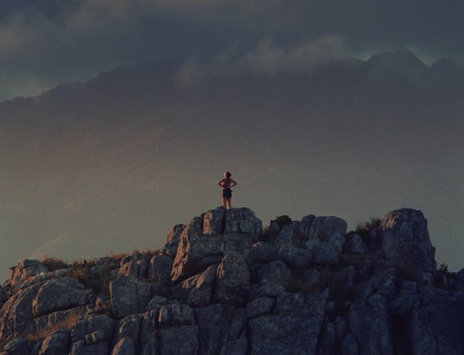 Still from Puma's Go Wild ad campaign showing a runner standing at the top of a hill