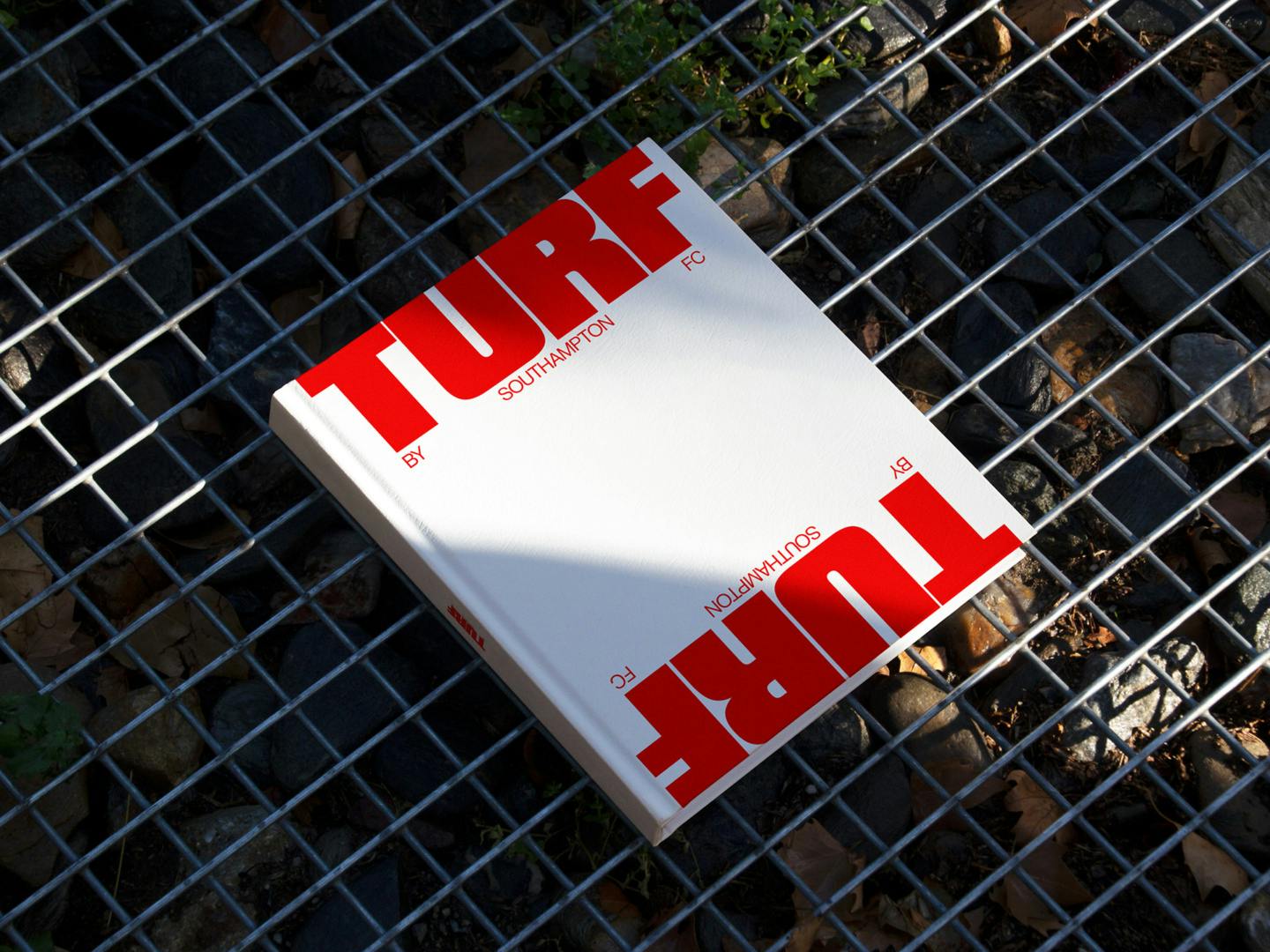 White book featuring the word 'Turf' at the top and bottom