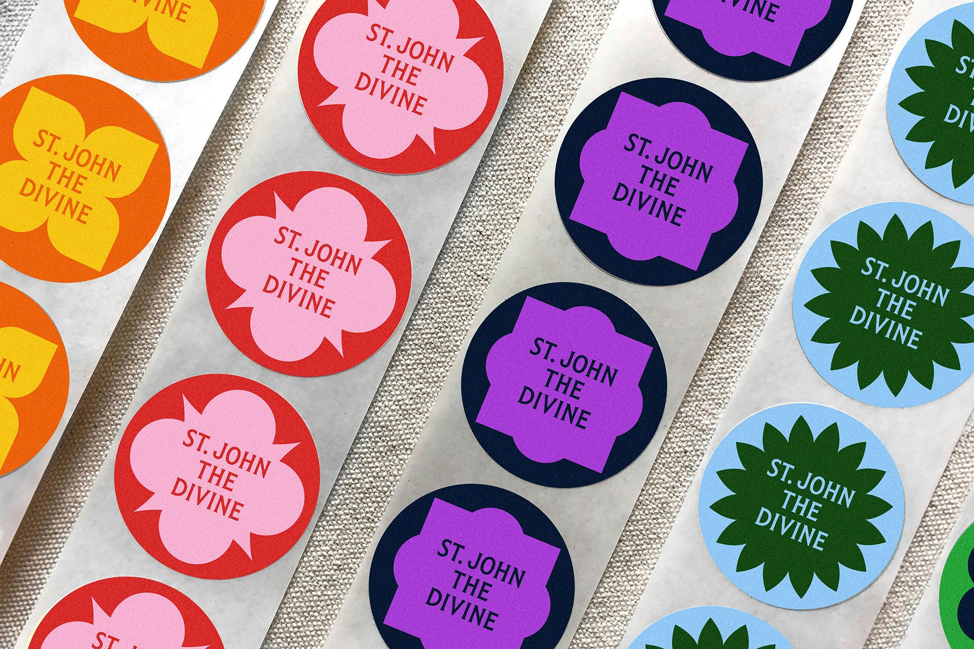 Rows of brightly coloured stickers labelled 'St John the Divine'